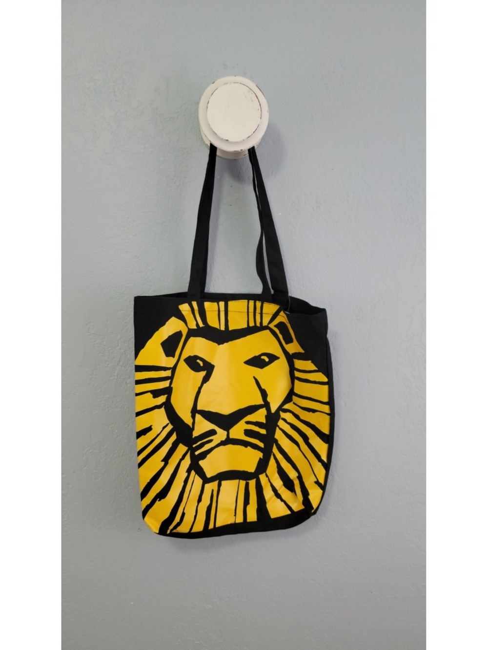 The Lion King Black Tote Bag with Yellow Lion Face Graphic